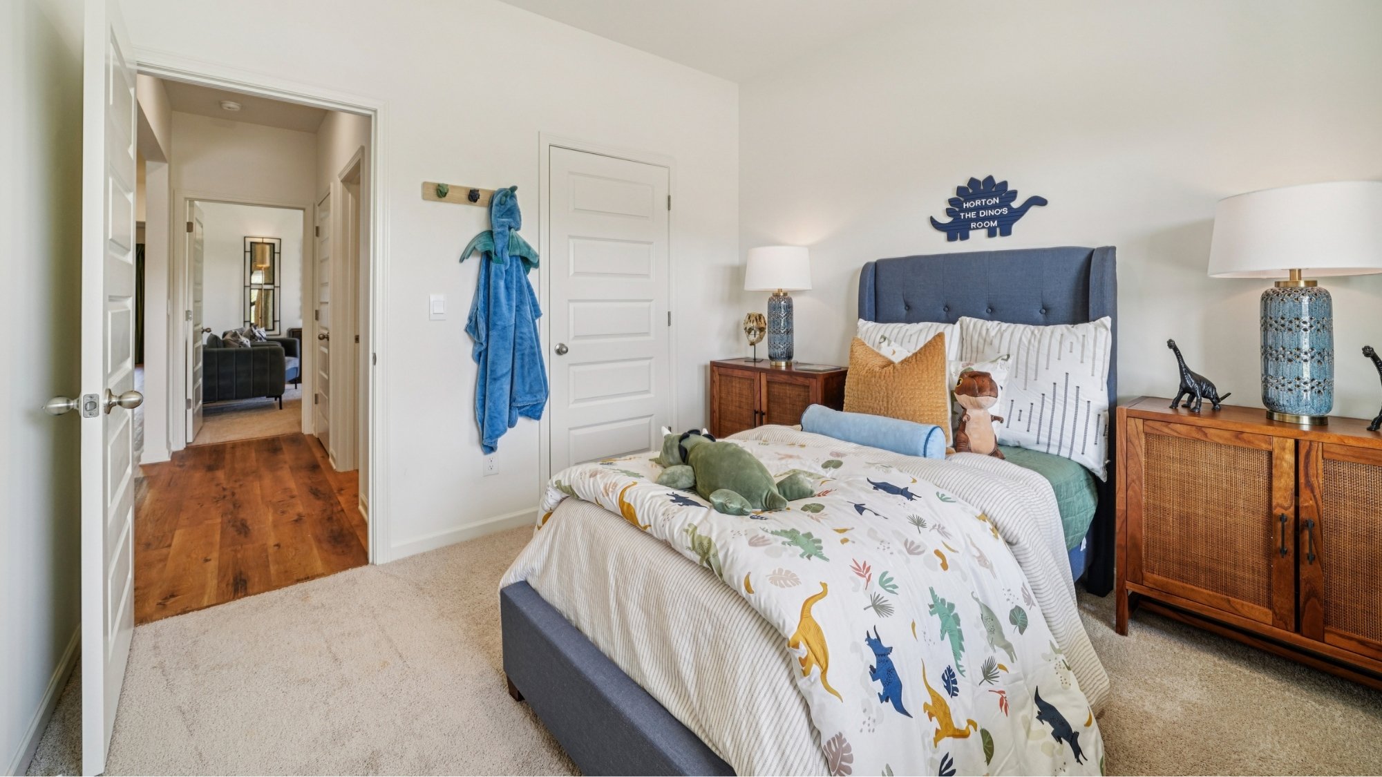 unique childrens bedroom with dinosaur statue and themse