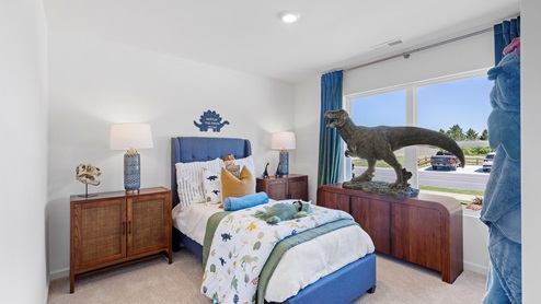 unique childrens bedroom with dinosaur statue and themse