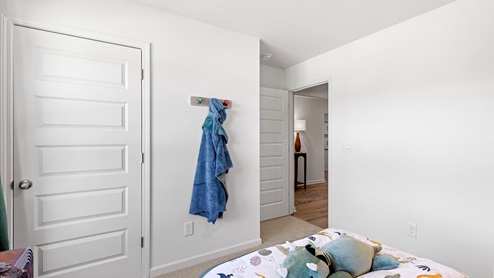 unique childrens bedroom with dinosaur statue and themse