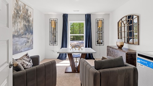 The fourth bedroom is currently being used as an office. It features an oversized desk with ample space still available in the room.