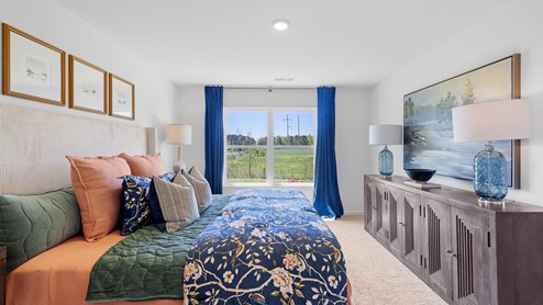 The spacious primary bedroom features a large king bed and two nightstands. Additionally, there is a sizable double window offering a view of the backyard. The large primary bedroom shows off ample space with a large king bed, 2 nightstands and a large double window that overlooks the backyard.