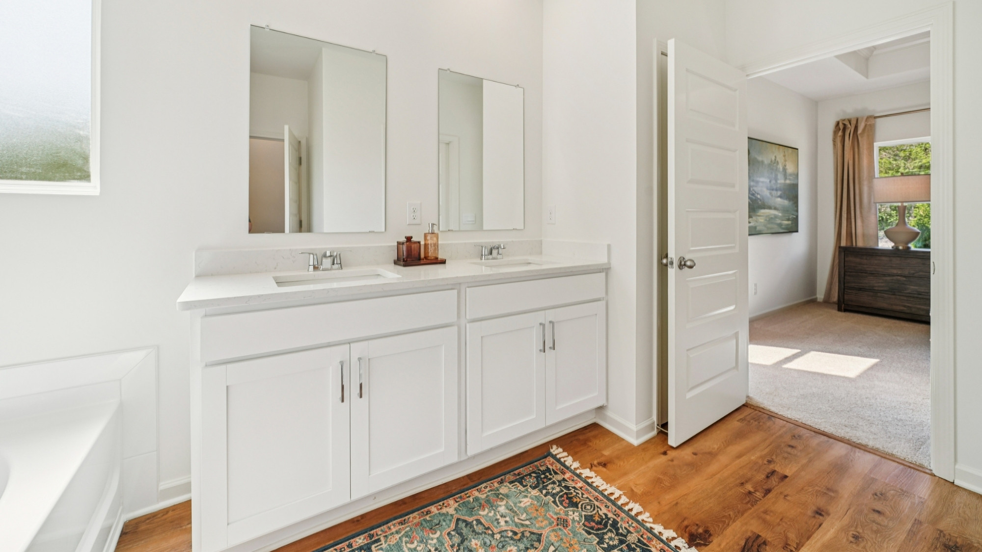 The primary bathroom features a double vanity.