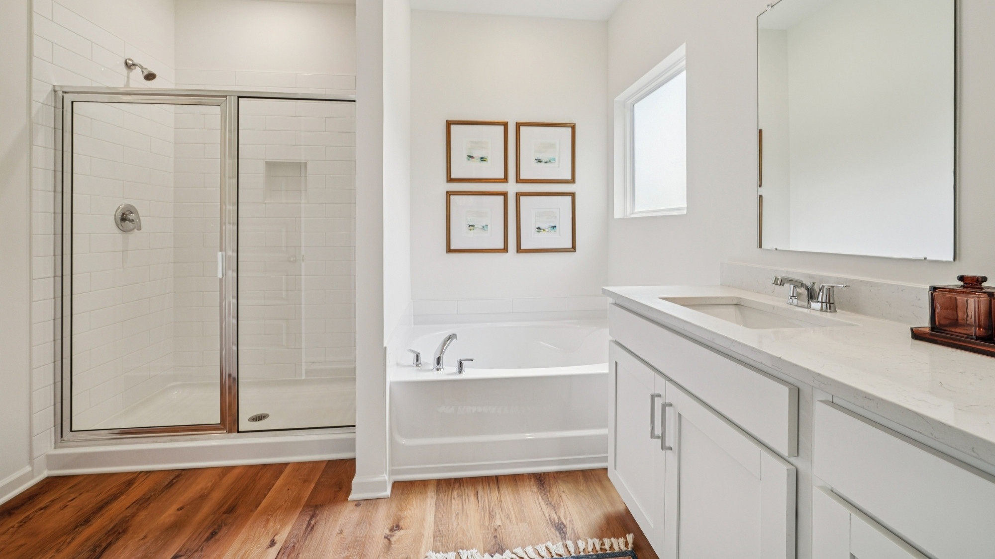 The primary also features a standalone shower and a soaker bath tub.