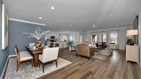 Dining room area with LVP flooring and windows