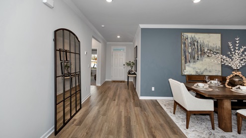 Dining room area with LVP flooring and windows