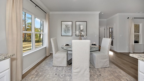 Dining room area with LVP flooring and windows