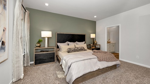 Primary bedroom with carpet