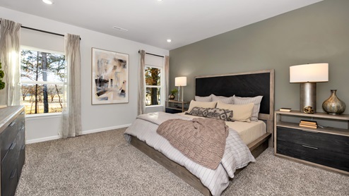 Primary bedroom with carpet