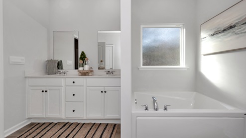 Primary bath with walk in shower and sitting tub