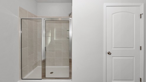 Primary bath with walk in shower and sitting tub