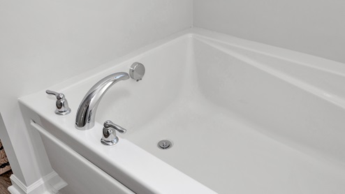 Primary bath with walk in shower and sitting tub