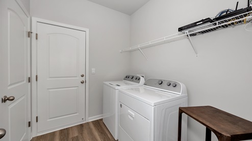 Laundry room with wire shelf and washer dryer hook up