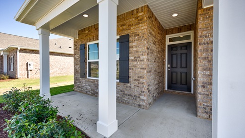 Covered porch with brick and columns