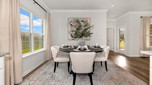 Dining room area with LVP flooring and windows