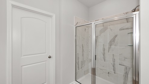 Primary bath with walk in shower and sitting tub