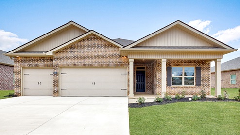 Single story home with brick and three car garage