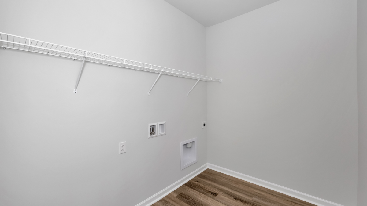 Laundry room with wire shelf and washer dryer hook up