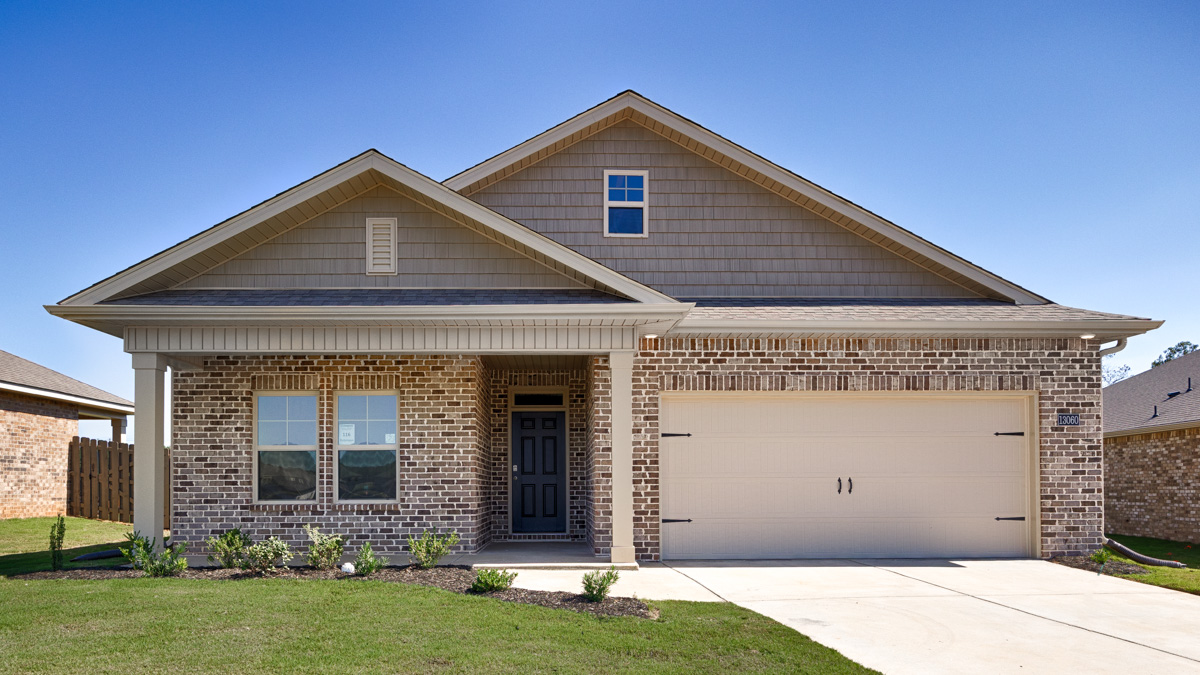 Single story home with brick and two car garage