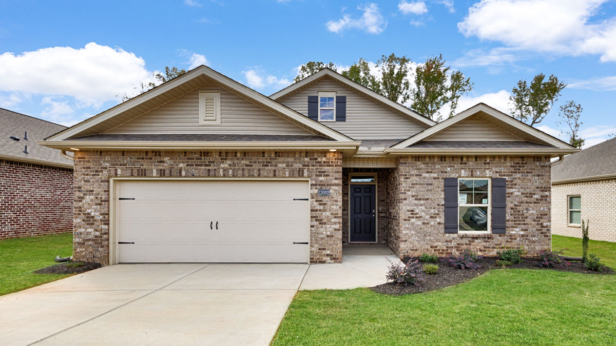 Single story home with brick and two car garage