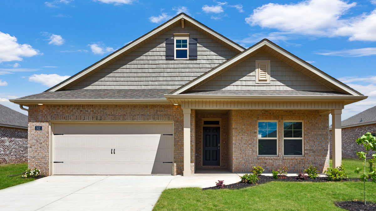 Single story home with brick and two car garage