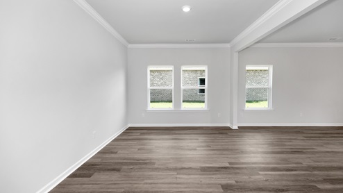 Dining room area with LVP flooring and windows