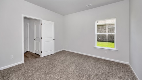 Primary bedroom with carpet
