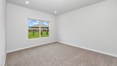 Primary bedroom with carpet