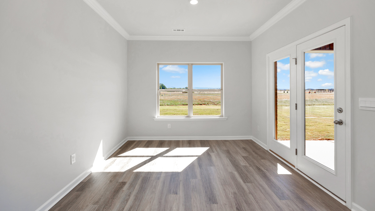Dining room area with LVP flooring and windows