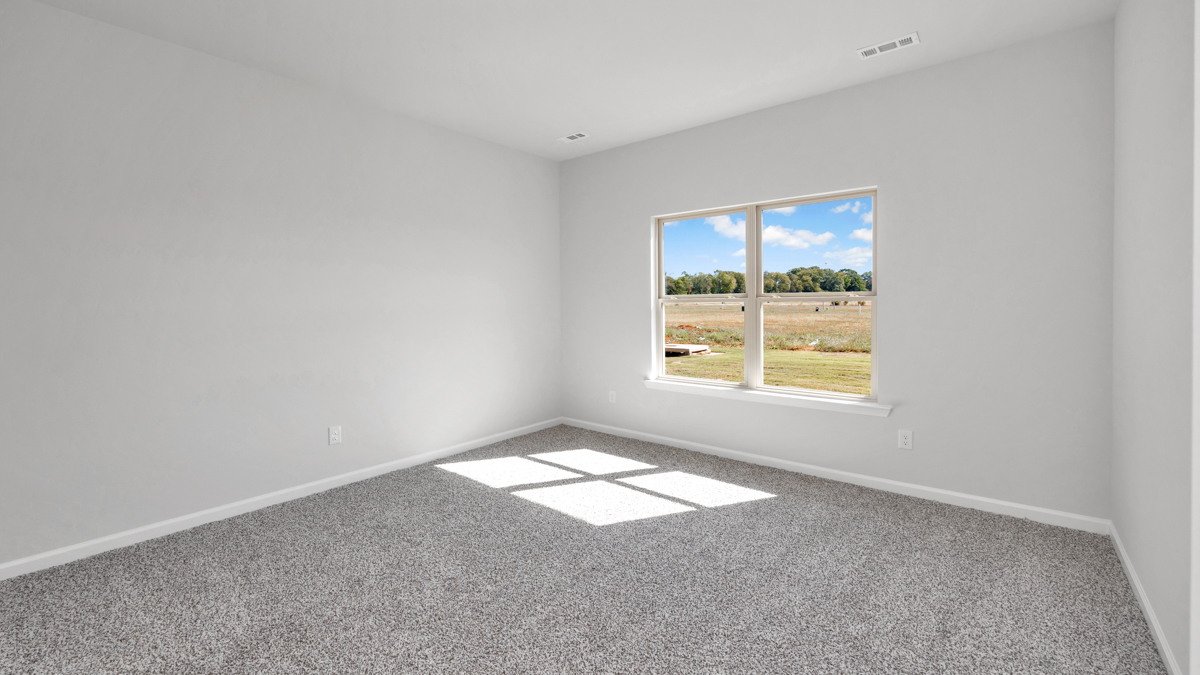 Primary bedroom with carpet