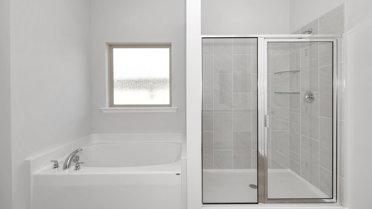 Primary bath with walk in shower and sitting tub