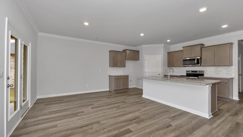 Kitchen island with view of dining / living room area