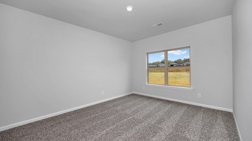 Primary bedroom with carpet
