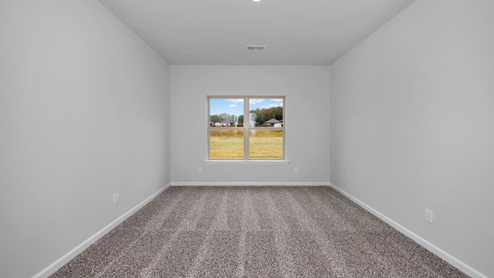 Primary bedroom with carpet