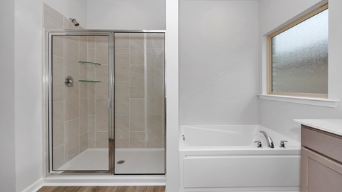 Primary bath with walk in shower and sitting tub