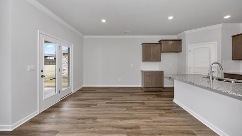 Kitchen island with view of dining / living room area