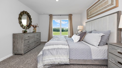 Primary bedroom with carpet