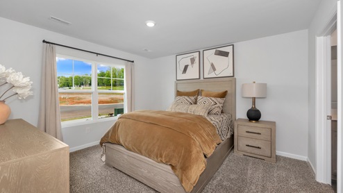 Primary bedroom with carpet