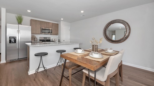Kitchen island with view of dining / living room area