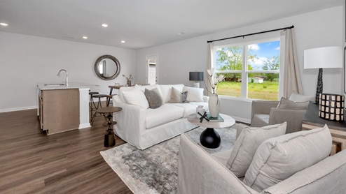 Kitchen island with view of dining / living room area