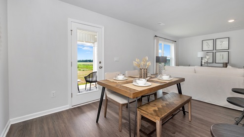 Dining room area with LVP flooring and windows
