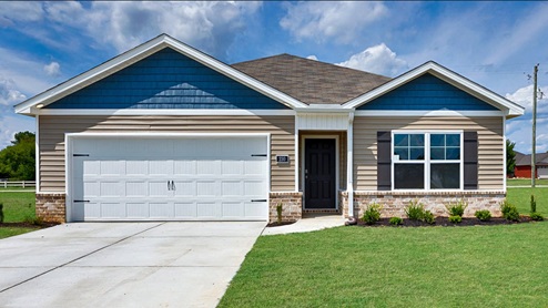 Single story home with vinyl and brick and two car garage