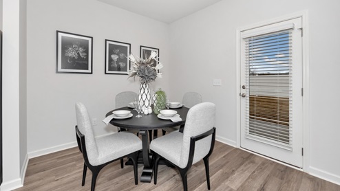 Dining room area with LVP flooring and windows