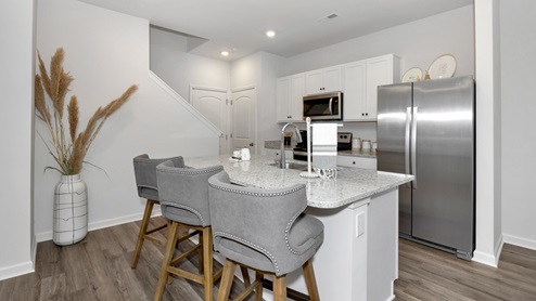Kitchen wall with granite surround and stainless steel stove