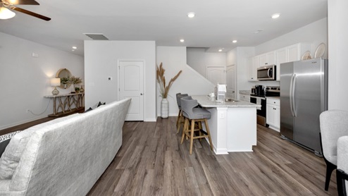 Kitchen island with view of dining / living room area