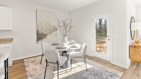 Dining room area with LVP flooring and windows