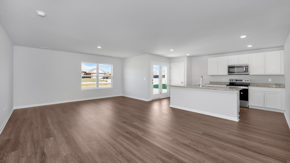 Kitchen island with view of dining / living room area