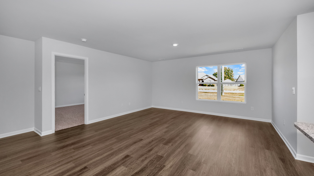 Dining room area with LVP flooring and windows