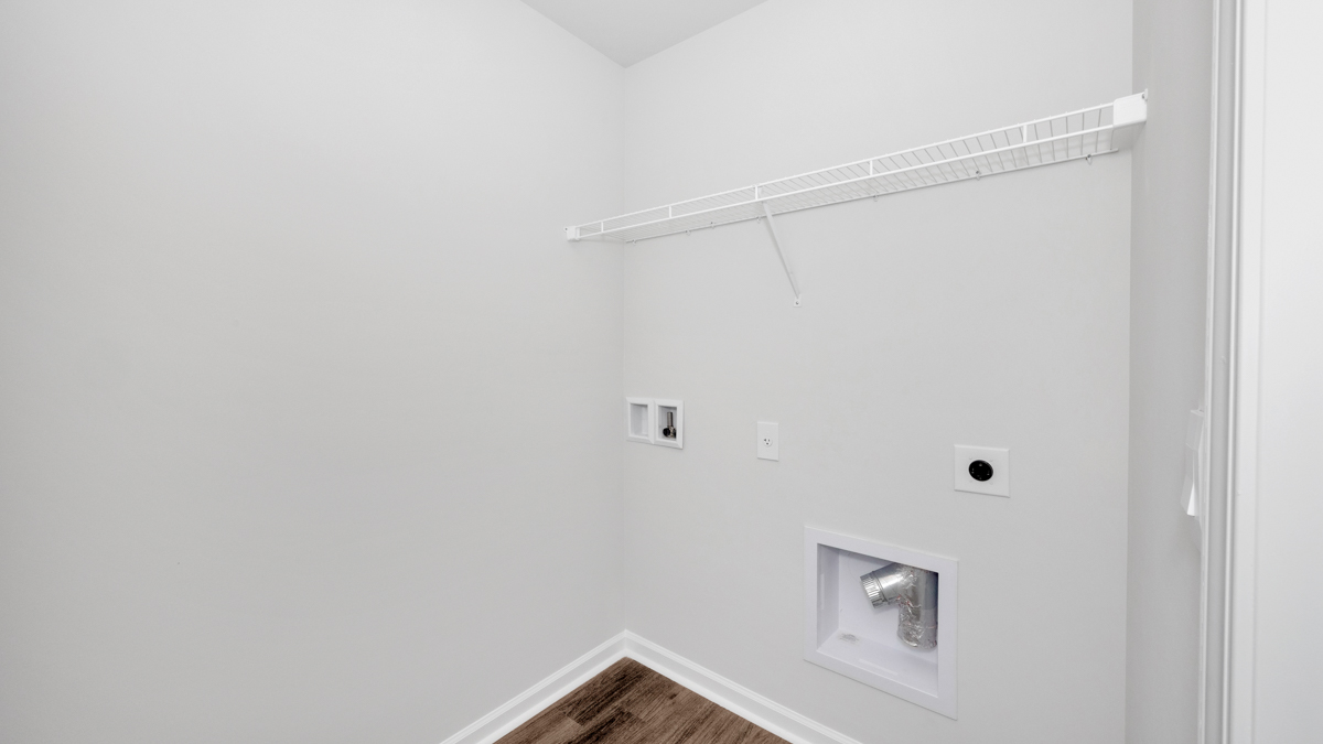Laundry room with wire shelf and washer dryer hook up