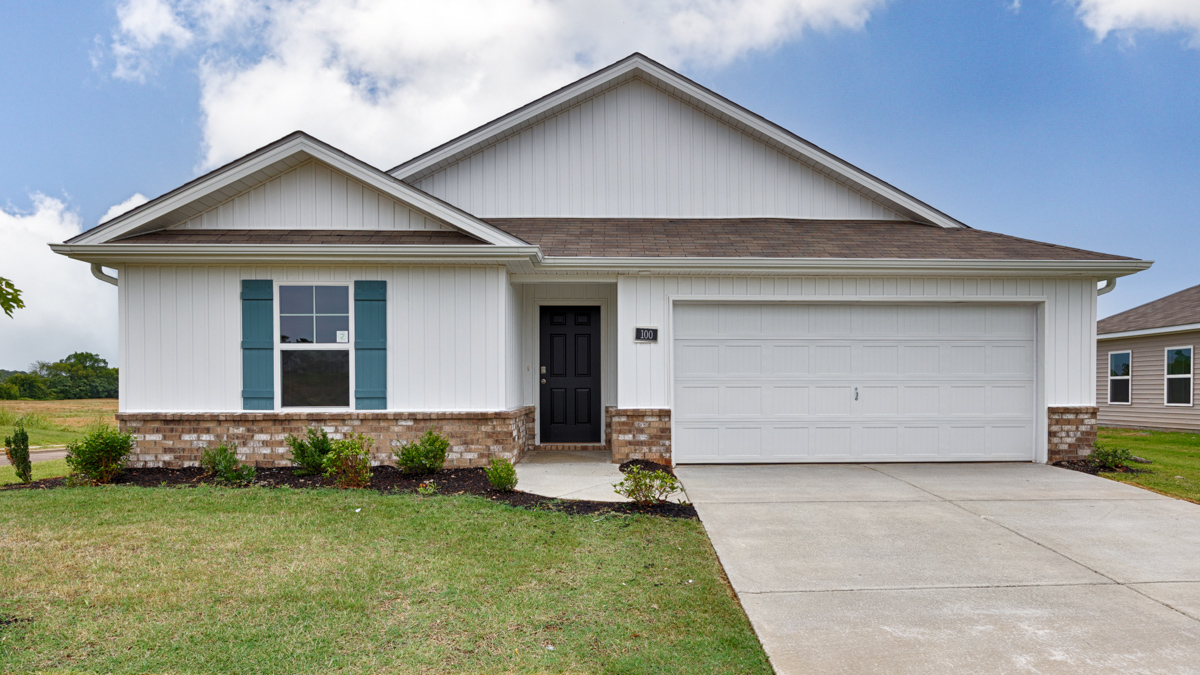 Single story home with vinyl and brick and two car garage