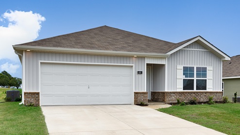 Single story home with vinyl and two car garage